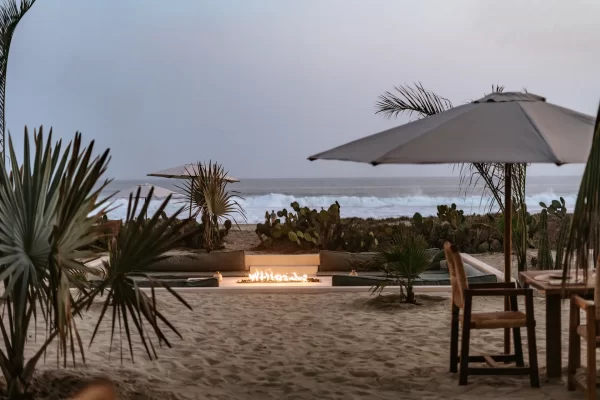 Casa Yuma illuminated at night, highlighting its architectural details and inviting atmosphere