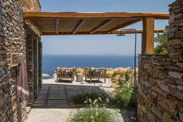 Aerial view of Verina Astra’s buildings blending into the Sifnos hillside, overlooking the Aegean Sea.