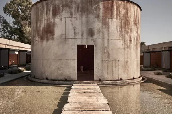 Restored 1920s wine tanks converted into modern hotel suites